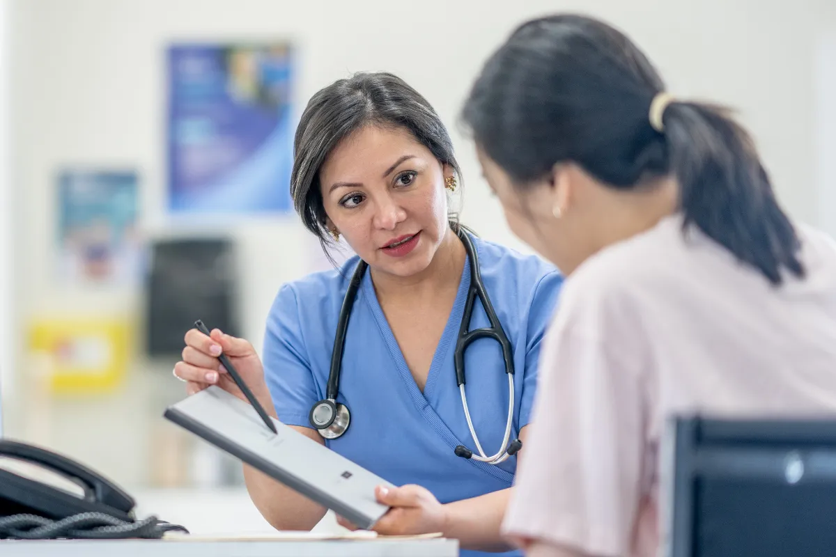 Doctor performing a breast exam