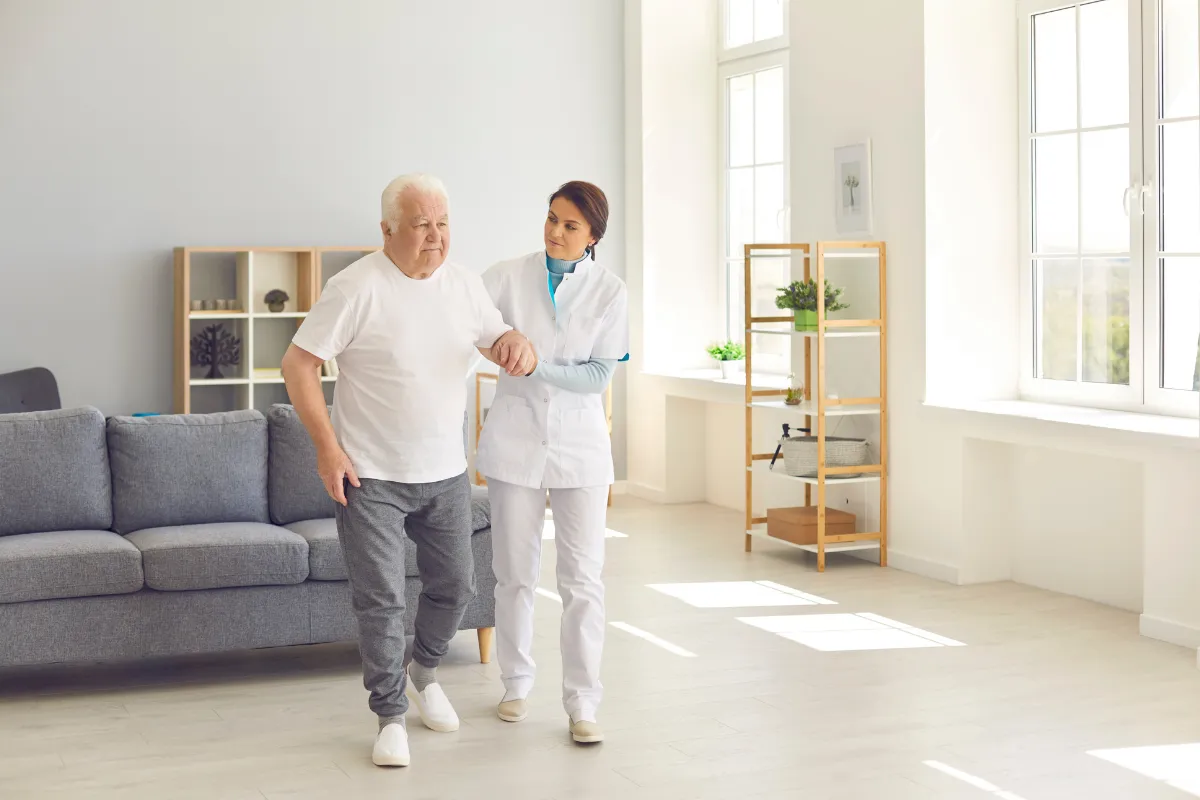 A doctor consulting with a senior patient and family member.