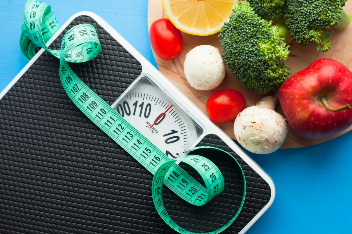 Weight Management: Achieving Your Goals In Spring, Tx 1 Doctor Reviewing A Patient'S Chart During A Weight Management Consultation.